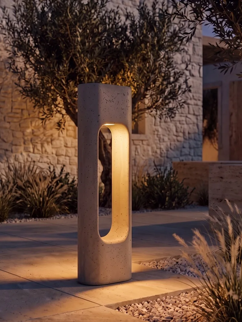 Light filtering between the two columns of the PORTAL concrete bollard at night