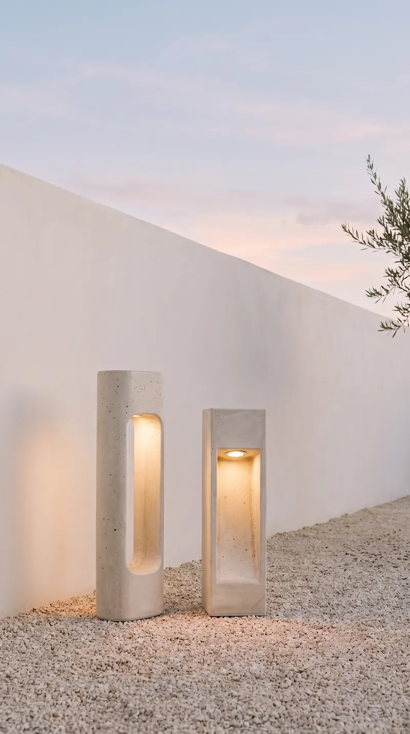 NICHE and PORTAL concrete lights glowing in front of a minimal white rendered wall