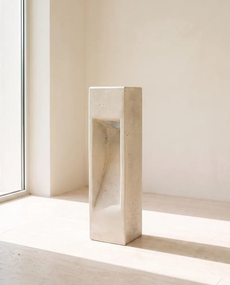 Sand-coloured NICHE concrete light in a sunlit room
